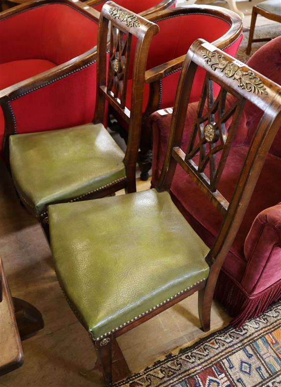 Pair of chairs with brass decoration